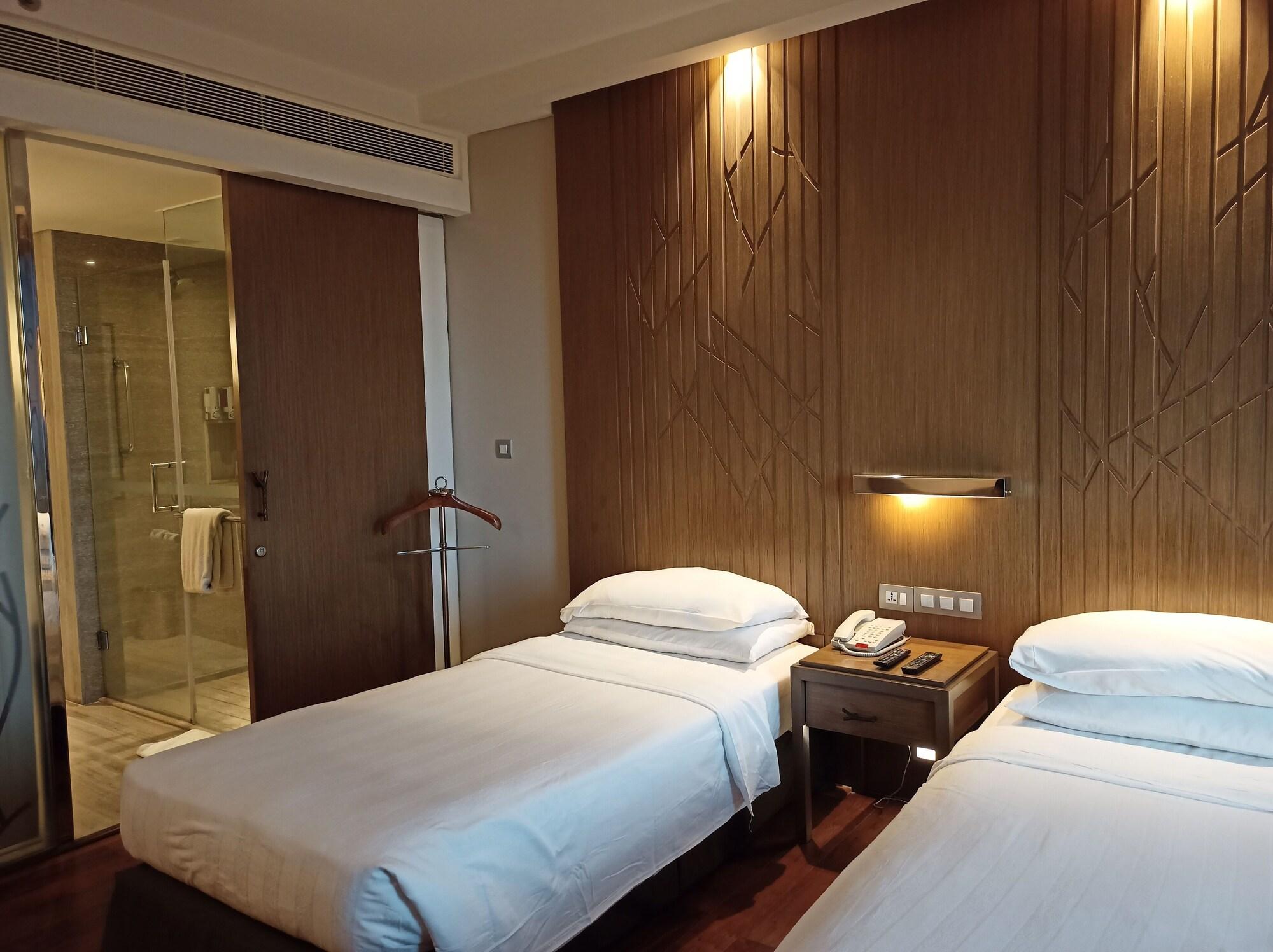 فندق ويلكوم هوتل بنجالور بنغالور المظهر الخارجي الصورة A room at the hotel
