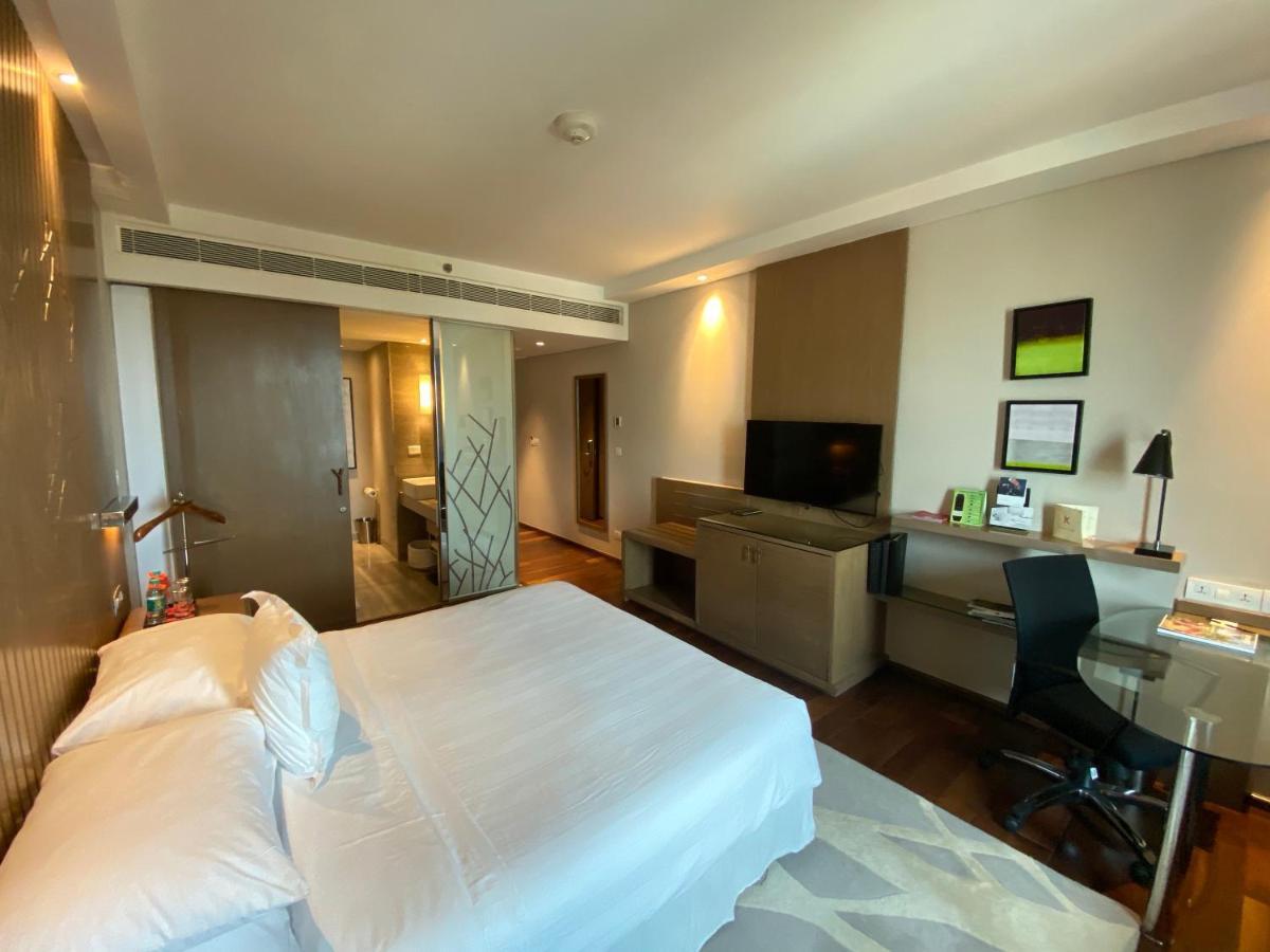 فندق ويلكوم هوتل بنجالور بنغالور المظهر الخارجي الصورة A room at the hotel